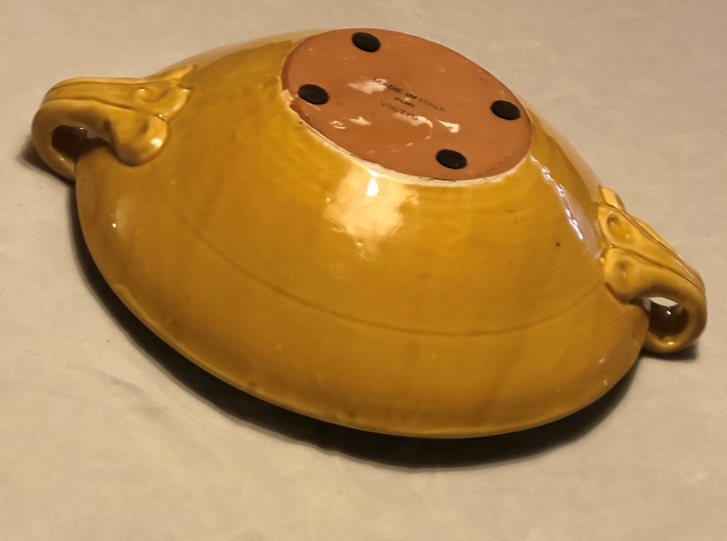 Ceramic Bowl - Approx: 12” Diameter Two (2) handles for easy carrying Handle-to-Handle - Approx: 15” Gold Background with Green & Cream Leaf Design Made in Italy for Vietri