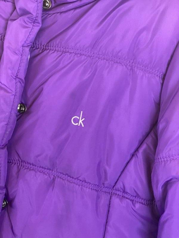 Deep Purple Coat Large (12-14) Attached Hood with Furry Trim Front Zipper and Snap Closures Two (2) Front Pockets Waist Belt with Hook Closure 30” Shoulder to Bottom 24” Sleeve Length 17” Across Chest