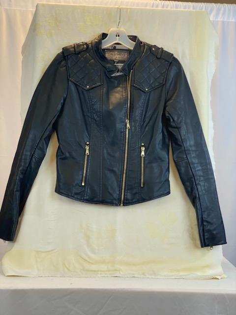 Leather-Like Black Jacket - Ci Sono by Cavalini Size Small Gold-Tone Zipper Front Closure Gold-Tone Zipper Two (2) Front Pockets Gold-Tone Zipper on Each Sleeve Gold-Tone Studs on Shoulders Quilted Trim on Shoulders and Back Skull Design on Lining 19” Shoulder to Bottom; .24” Sleeve; 17” Across Chest