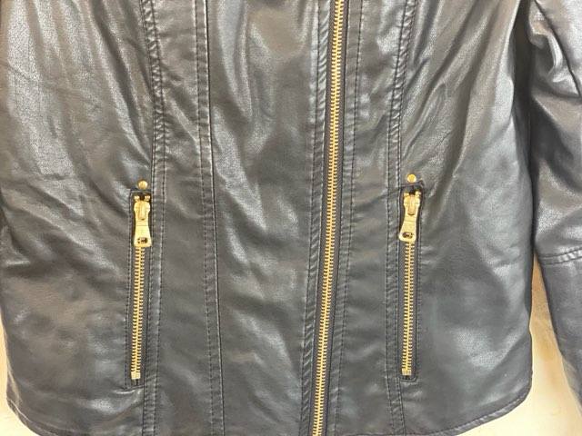 Leather-Like Black Jacket - Ci Sono by Cavalini Size Small Gold-Tone Zipper Front Closure Gold-Tone Zipper Two (2) Front Pockets Gold-Tone Zipper on Each Sleeve Gold-Tone Studs on Shoulders Quilted Trim on Shoulders and Back Skull Design on Lining 19” Shoulder to Bottom; .24” Sleeve; 17” Across Chest