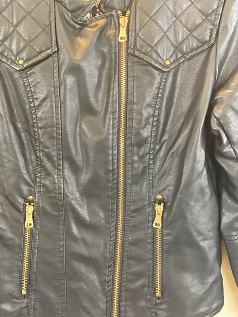 Leather-Like Black Jacket - Ci Sono by Cavalini Size Small Gold-Tone Zipper Front Closure Gold-Tone Zipper Two (2) Front Pockets Gold-Tone Zipper on Each Sleeve Gold-Tone Studs on Shoulders Quilted Trim on Shoulders and Back Skull Design on Lining 19” Shoulder to Bottom; .24” Sleeve; 17” Across Chest
