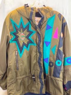 Pea Green - Geometric Pattern/Design on Coat Medium Size Polyester Lining Zipper and Snap Front Closure Two (2) Zipper Front Pockets Two (2) Inside Pockets Attached Hood 27” Length 23” Sleeve 23” Chest