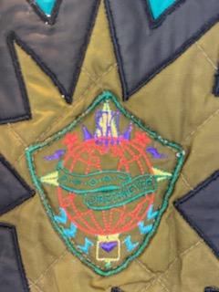 Pea Green - Geometric Pattern/Design on Coat Medium Size Polyester Lining Zipper and Snap Front Closure Two (2) Zipper Front Pockets Two (2) Inside Pockets Attached Hood 27” Length 23” Sleeve 23” Chest