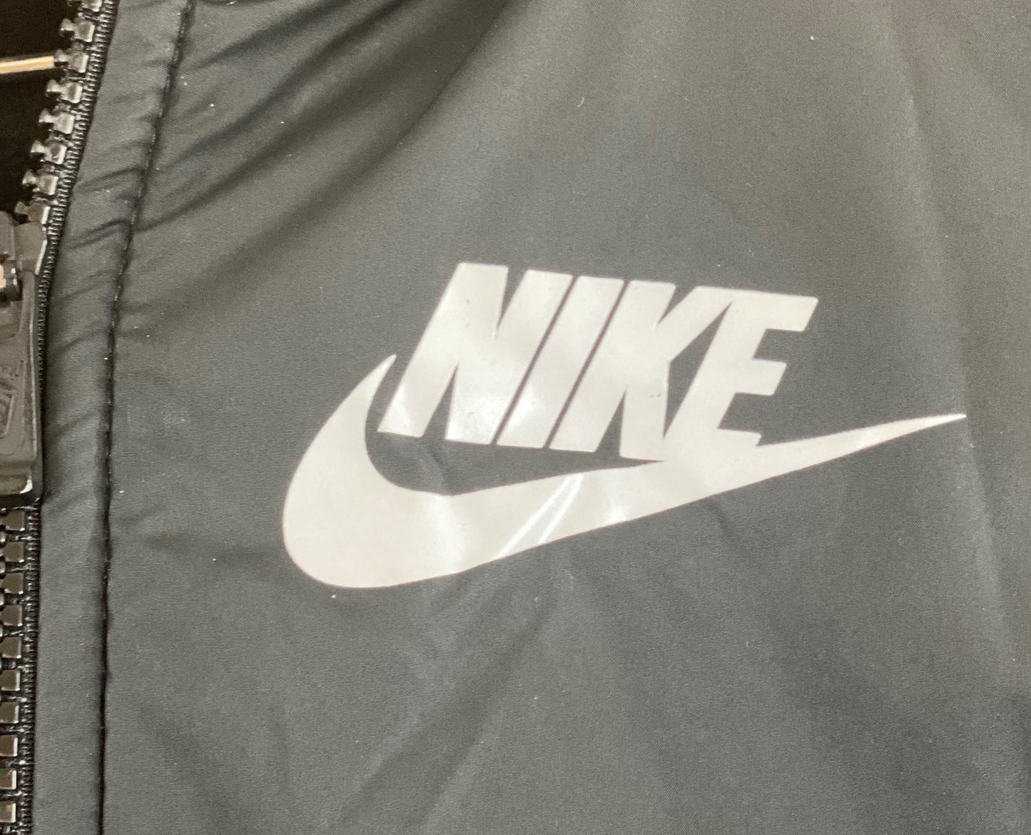 Nike Jacket with Attached Hood Fleece/Nylon Size Medium Zipper Front Closure Two (2) Front Pockets 20” Shoulder to Bottom; 20” Sleeve; 16” Across Chest