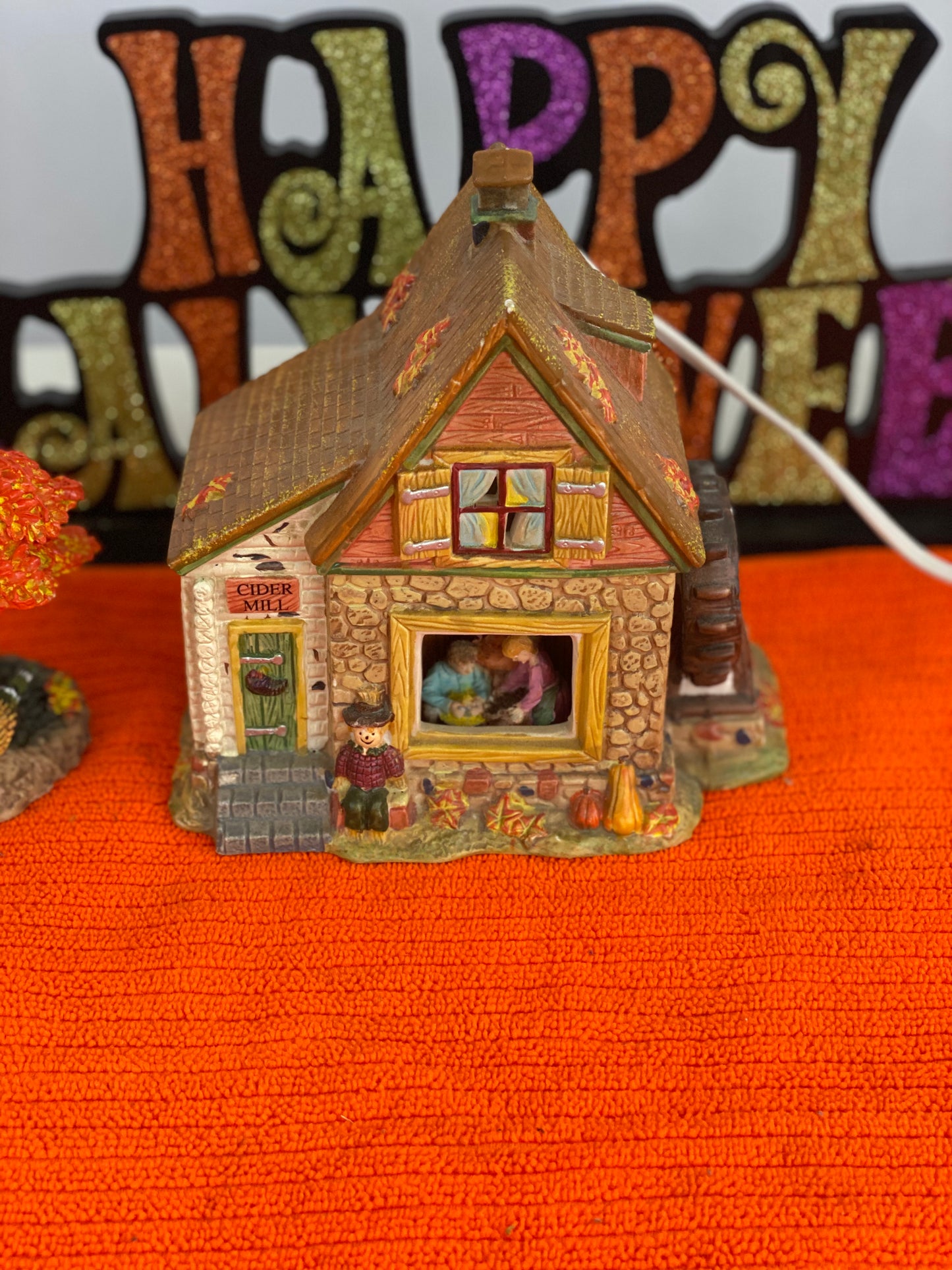 Ceramic House/Cider Mill with Tree House Approx. 6.5” H x 6” W House is Electric/Illuminated with Autumn Decor Tree is 6” H x 3.5 W with Autumn Decor