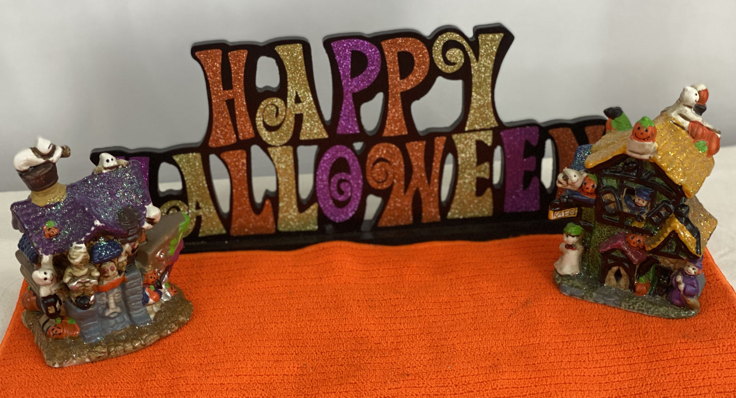 Set of Haunted Houses - Two (2) Ceramic With Sparkly Finish Many Decorations on Each House Each House is Approx. 5”H x 4” W Electric-Illumination