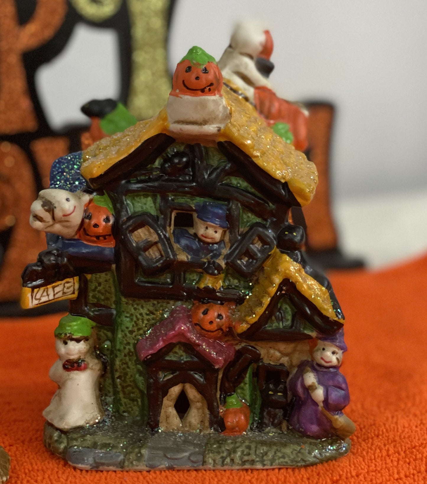 Set of Haunted Houses - Two (2) Ceramic With Sparkly Finish Many Decorations on Each House Each House is Approx. 5”H x 4” W Electric-Illumination