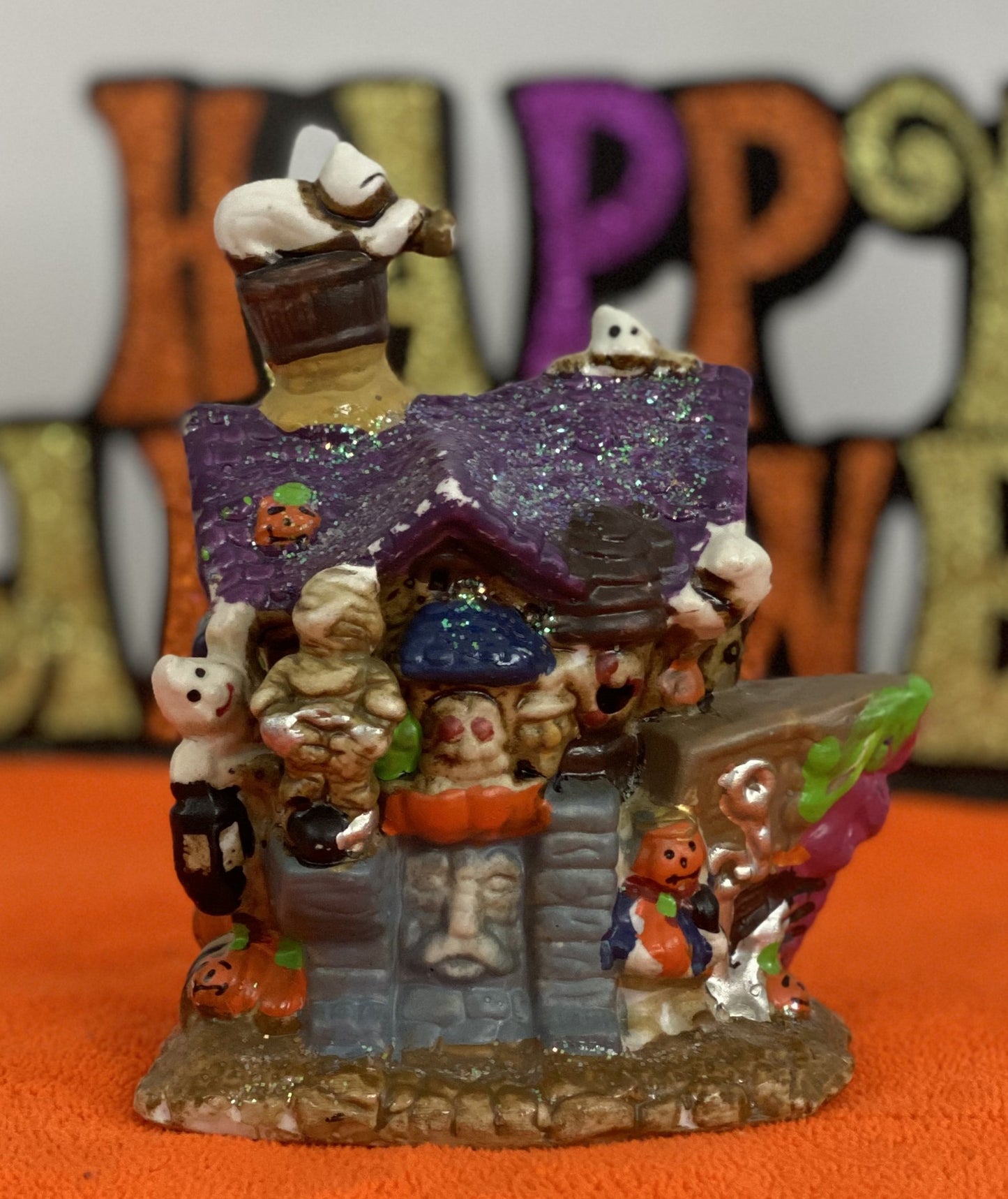 Set of Haunted Houses - Two (2) Ceramic With Sparkly Finish Many Decorations on Each House Each House is Approx. 5”H x 4” W Electric-Illumination