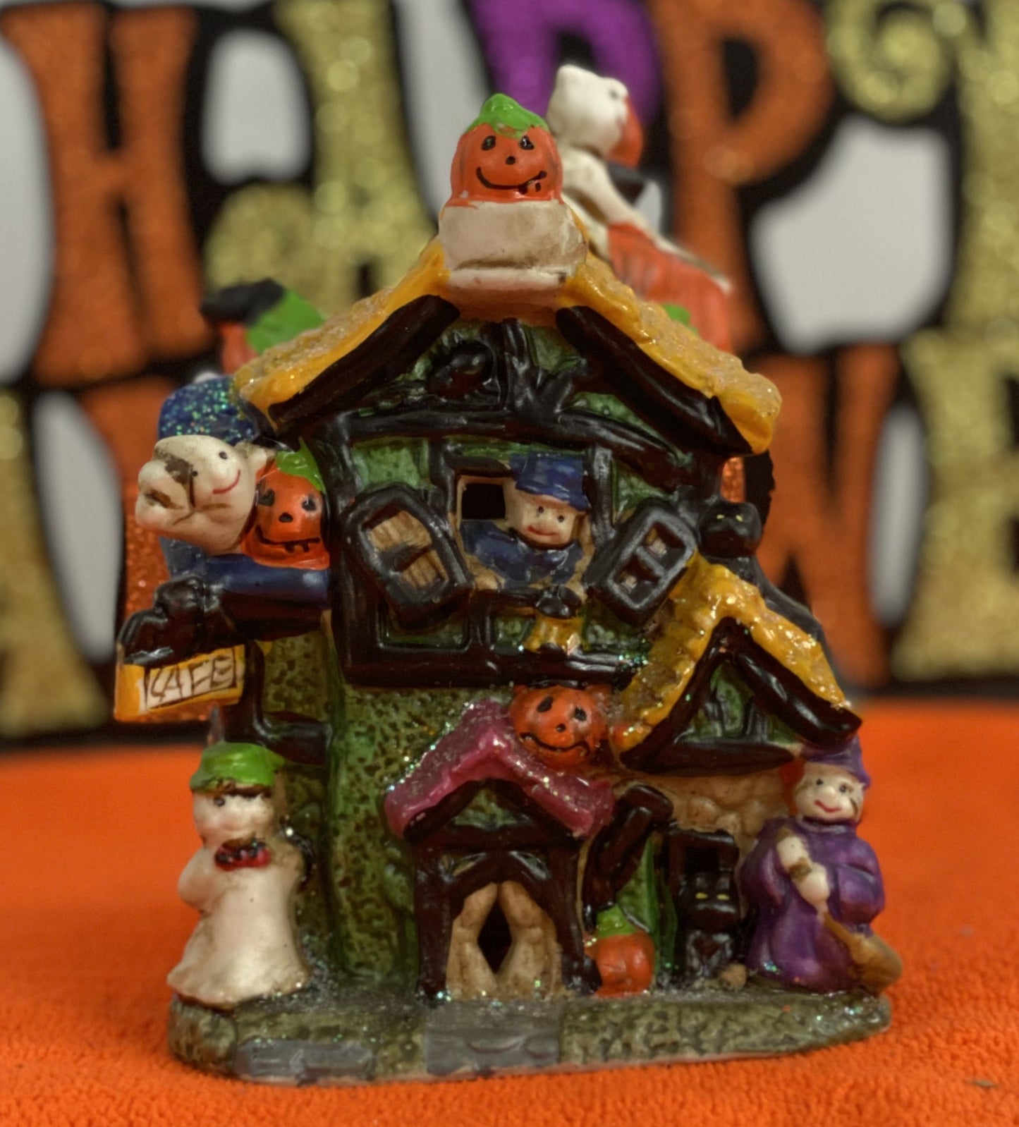 Set of Haunted Houses - Two (2) Ceramic With Sparkly Finish Many Decorations on Each House Each House is Approx. 5”H x 4” W Electric-Illumination