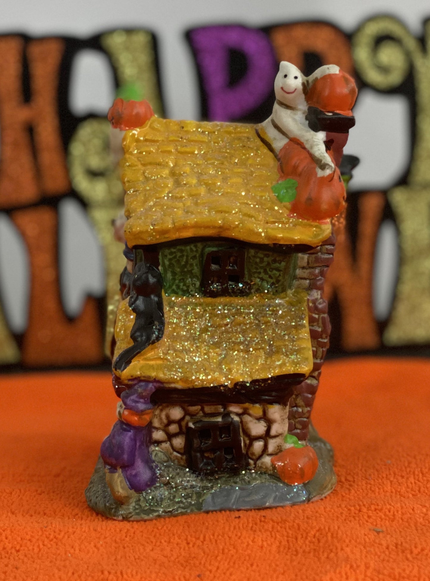 Set of Haunted Houses - Two (2) Ceramic With Sparkly Finish Many Decorations on Each House Each House is Approx. 5”H x 4” W Electric-Illumination