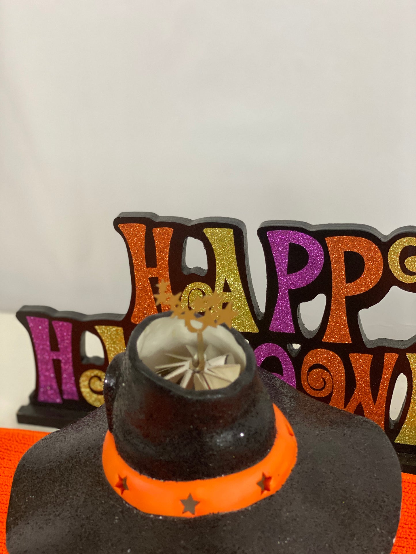 Ceramic Witch’s Home Decorated with: Witch Hat Roof Witch’s Shoes at Doorstep Witch’s Broom Spider Web Pumpkins Opening for candle for Lighting