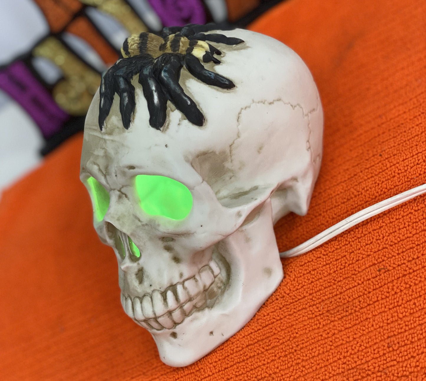Seasonal-Halloween Ceramic Skull with Spider on Top of Skull Electric-Illumination Approx 5” H x 3.5 Wide Made in Taiwan