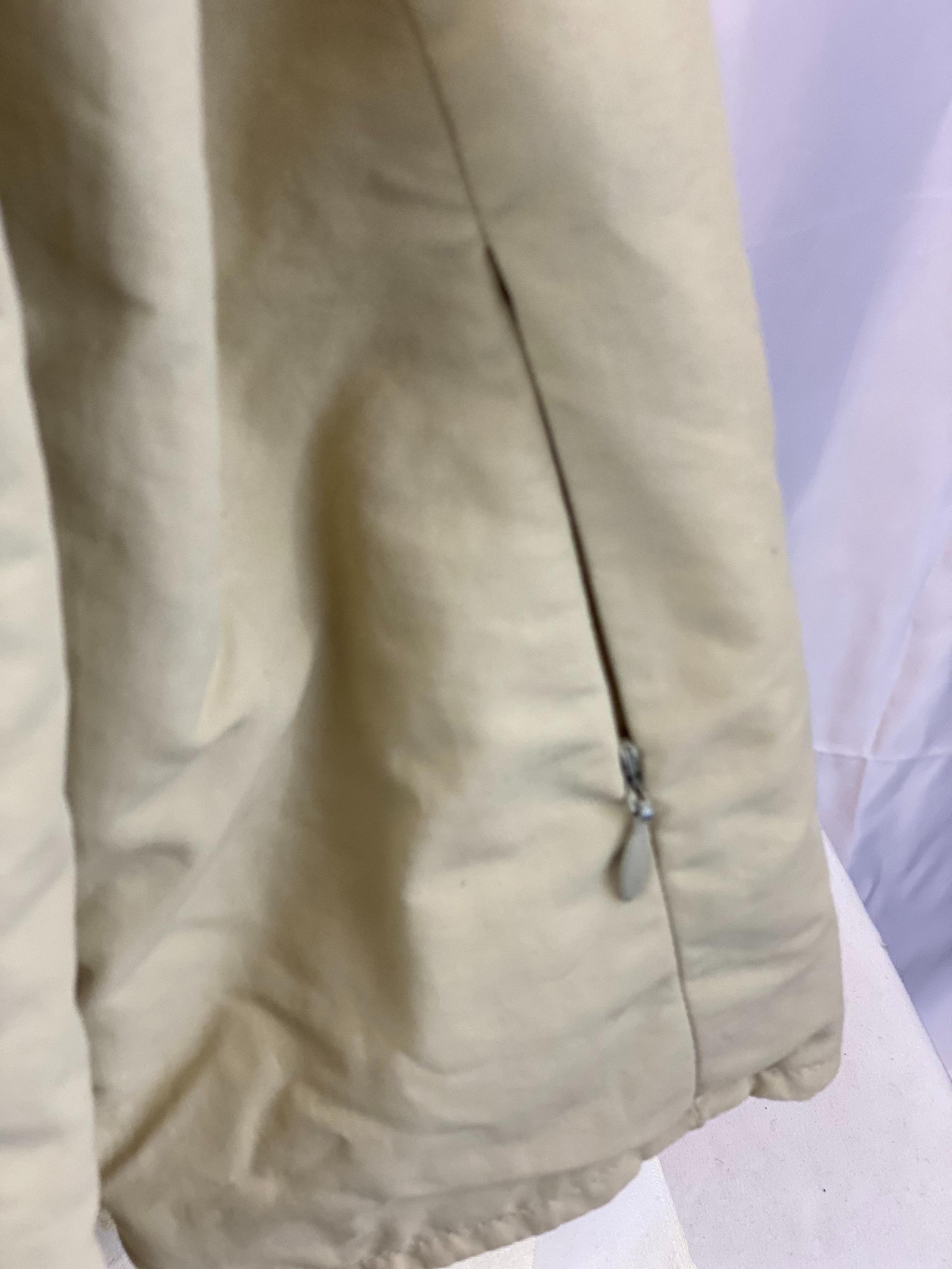 Pre-Owned - Excellent Condition  Girl’s Size Small Coat Attached Hood Four (4) Zipper Pockets on Front Zipper Pocket on Each Sleeve 100% Polyester 24” Length;  23” Sleeve;  19” Across Chest Made in Thailand