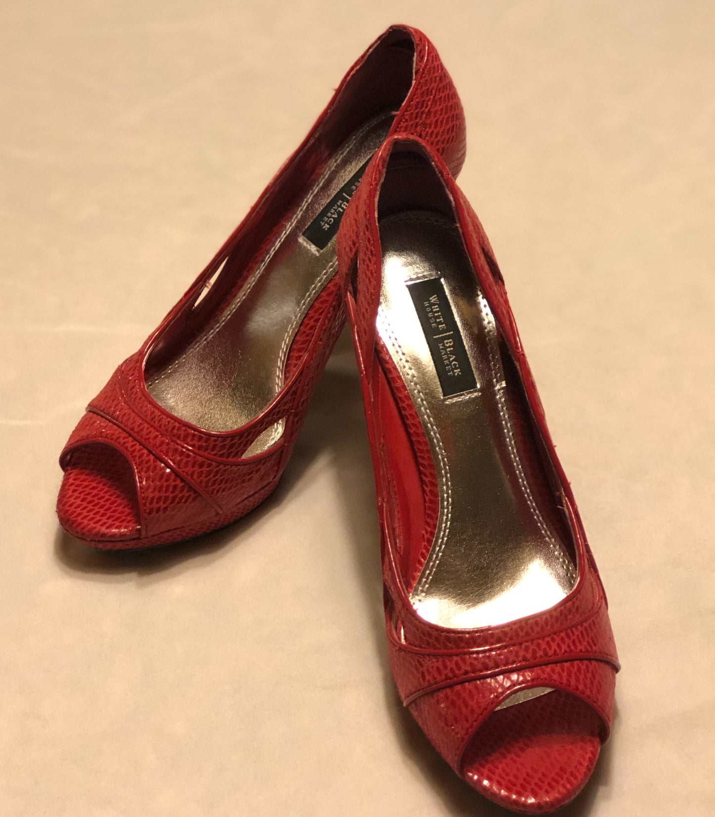 White House/Black Market Red Heels  Cut-Out Design on Sides  Leather Soles  - Slight Wear on Soles  Approx 4” Heels  Open Toe 