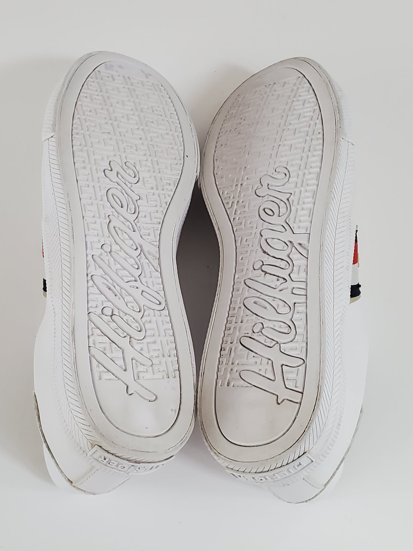 White with Red/White/Blue Stripe Accents  TH Initials on Side of Sneaker  Low Top - Lace up  Very Clean Pre-Owned Sneakers