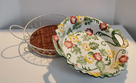 Round Serving Dish With Metal Carrier 14” Round/Diameter Dish is White With Red & Yellow Flowers & Green Leaf Design Carrier is White Criss/Cross Metal withTwo (2) Handles & Removable Rattan Bottom