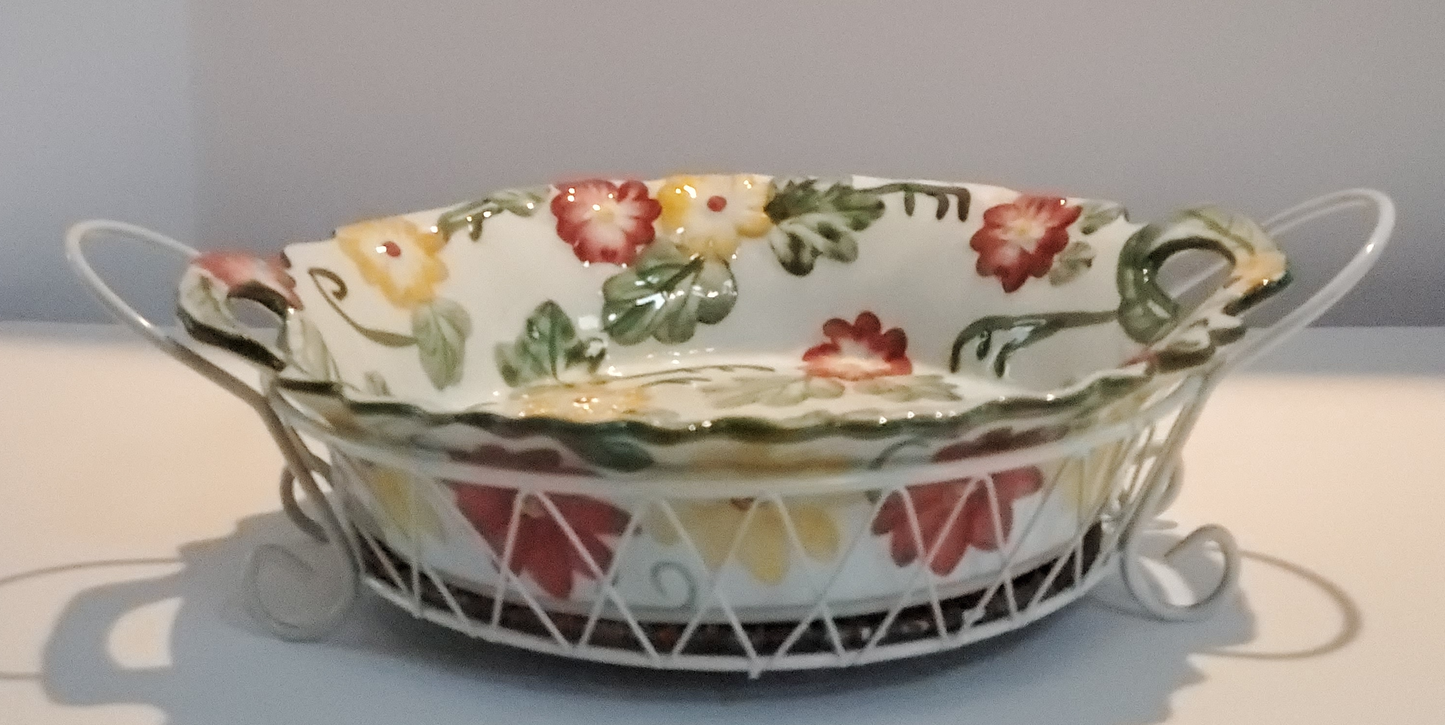 Round Serving Dish With Metal Carrier 14” Round/Diameter Dish is White With Red & Yellow Flowers & Green Leaf Design Carrier is White Criss/Cross Metal withTwo (2) Handles & Removable Rattan Bottom