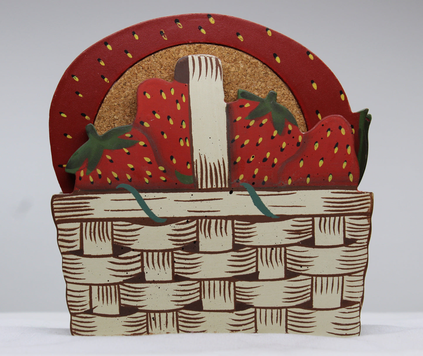 Set of four (4) Wooden Coasters 			Cork Inlay 			Strawberry Design 			Holder -  Wooden Shaped/Designed                Basket With Strawberries 	                                  Approx:    4.5”W x 5”H