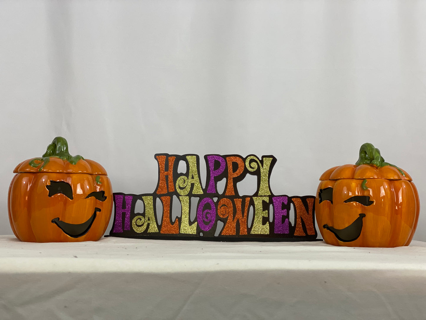 Approximate Size - 7” x 7”  Cut-out Facial Features  Includes Votive Candle  Pumpkin Only - Does Not Include “Happy Halloween” Sign