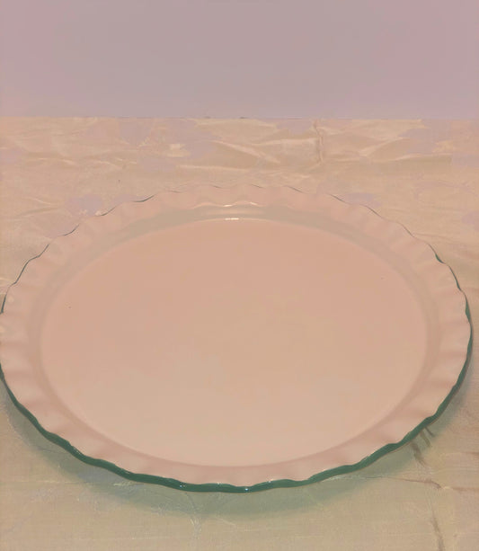 Round two (2) piece Cake Plate & Cover  Cover is Pink and White with Pink Ribbon  Plate is White with Green Trim;  Approx. Size =  Cover - 4” High - 10” Wide  Plate - 12” Wide  Pre-Owned - Excellent Conditi