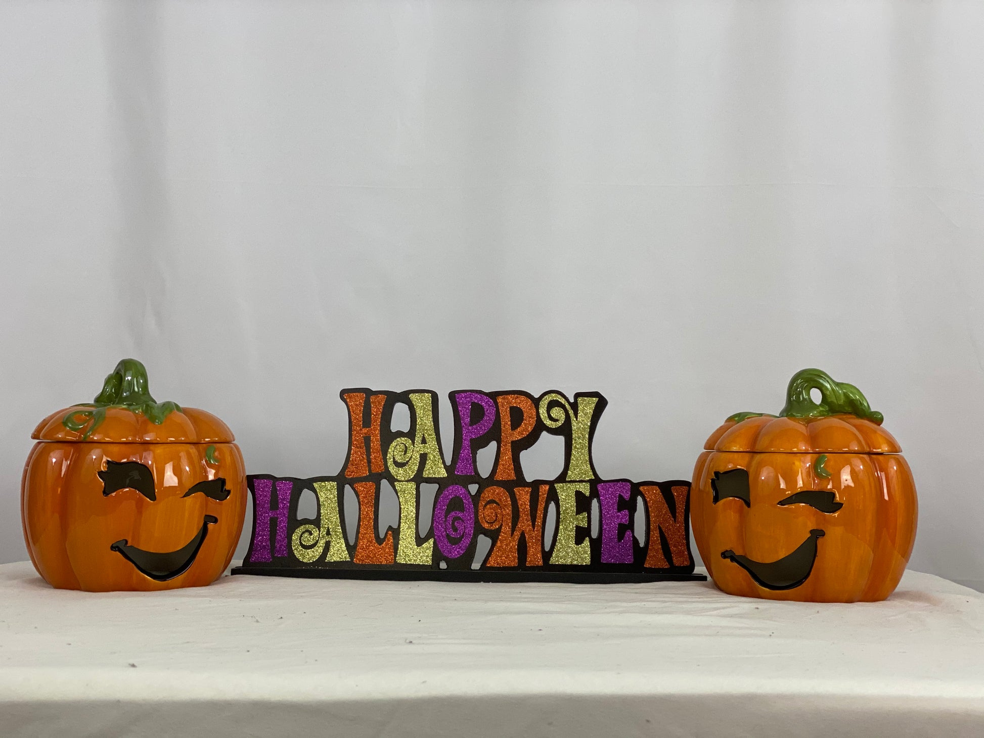 Approximate Size - 7” x 7”  Cut-out Facial Features  Includes Votive Candle  Pumpkin Only - Does Not Include “Happy Halloween” Sign