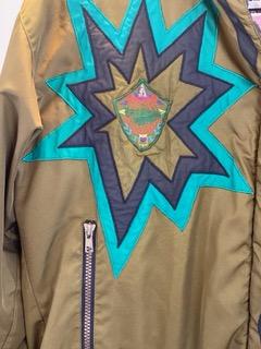 Pea Green - Geometric Pattern/Design on Coat  Medium Size  Polyester Lining  Zipper and Snap Front Closure  Two (2) Zipper Front Pockets  Two (2) Inside Pockets  Attached Hood  27” Length  23” Sleeve  23” Chest