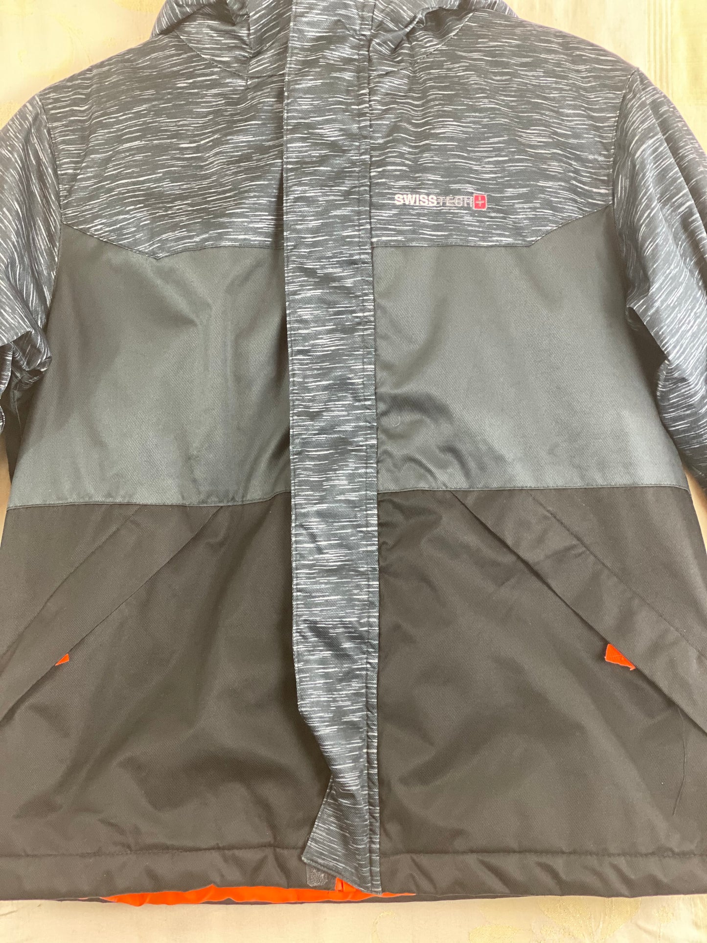 Pre-Owned - Excellent Condition  Black Swiss Tech Boy’s Coat Size M/8 Orange Lining Attached Hood Zipper Front Closure Two (2) Zipper Front Pockets 22” Shoulder to Bottom;  19” Sleeve;  18 Across Chess