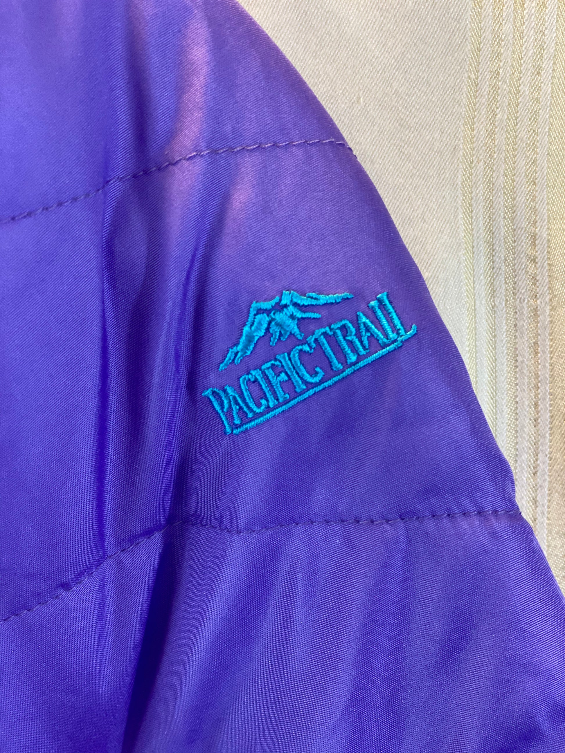 Pre-Owned - Excellent Condition   Girl’s Coat - Size 4-T  Purple & Aqua Color  Attached Hood  Two (2) Front Pockets  16” Shoulder to Bottom;  14” Sleeve;  13’ Across Chest  100% Polyester