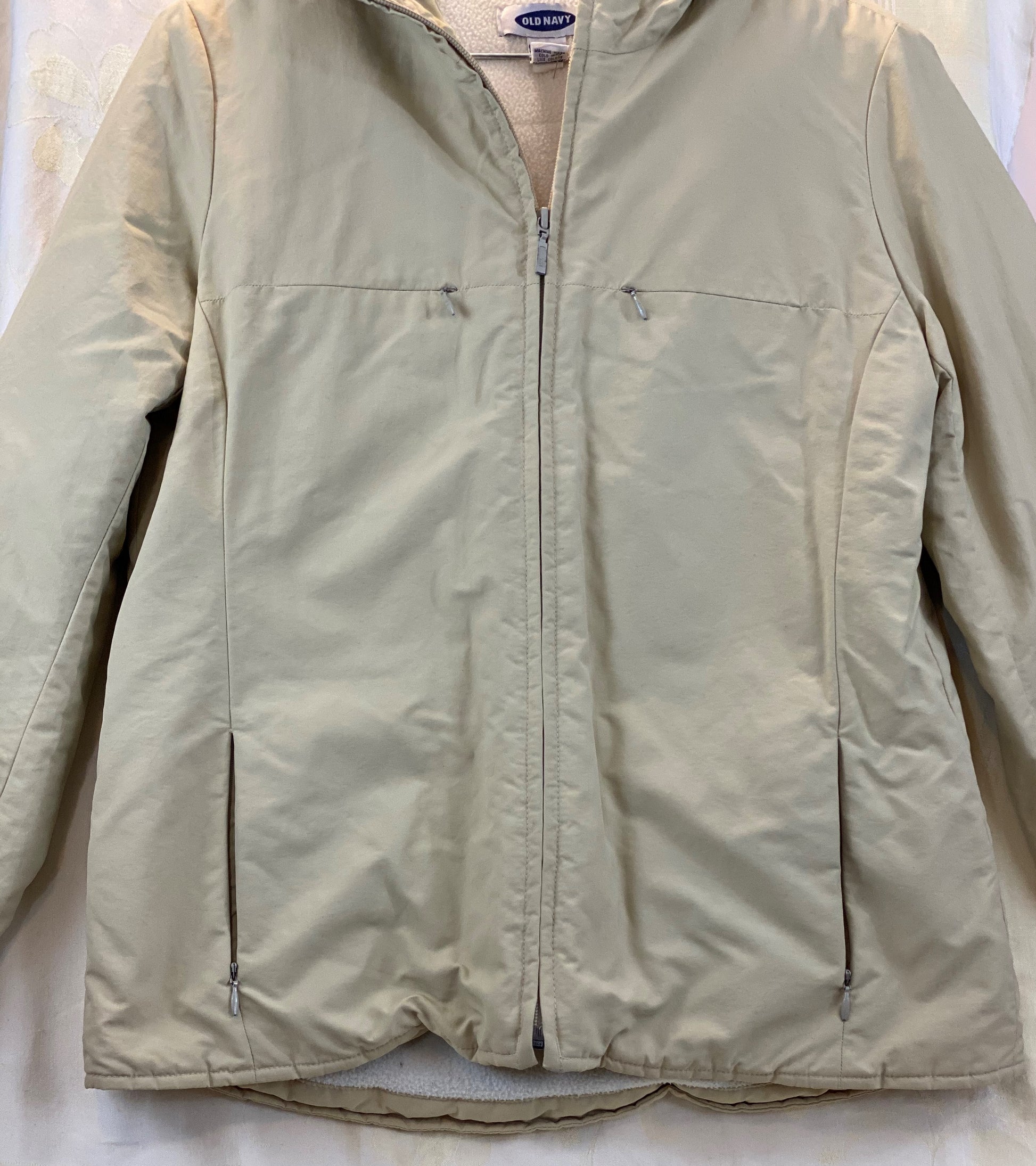 Pre-Owned - Excellent Condition  Girl’s Size Small Coat Attached Hood Four (4) Zipper Pockets on Front Zipper Pocket on Each Sleeve 100% Polyester 24” Length;  23” Sleeve;  19” Across Chest Made in Thailand