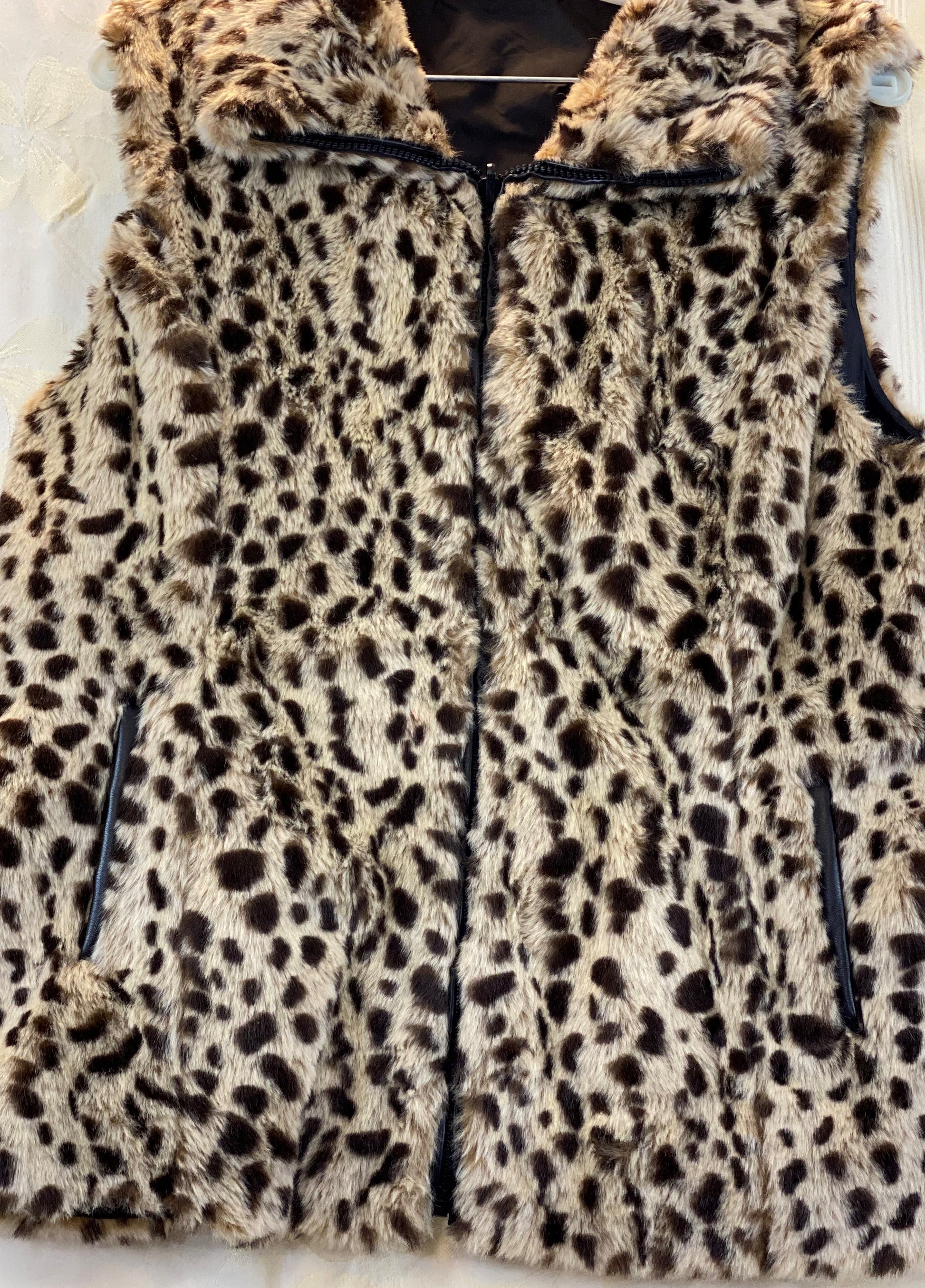 Pre-Owned - Excellent Condition   Furry Leopard Print  Front Zipper Closure   Two (2) Outside Pockets  Two (2) Inside Pockets   Leopard Collar