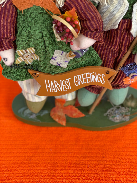 Approx. 9.5 W x 13.5 H  Clothing is made of cloth/corduroy fabric  Decorated with seasonal images and “Harvest Greetings” sign