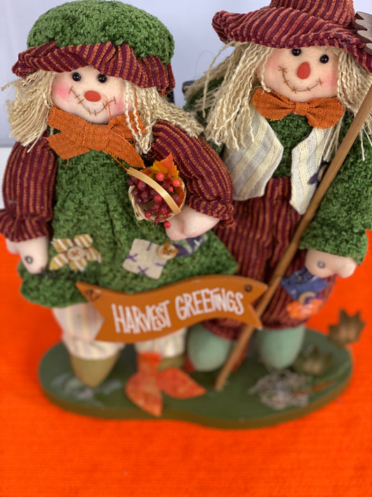Approx. 9.5 W x 13.5 H  Clothing is made of cloth/corduroy fabric  Decorated with seasonal images and “Harvest Greetings” sign