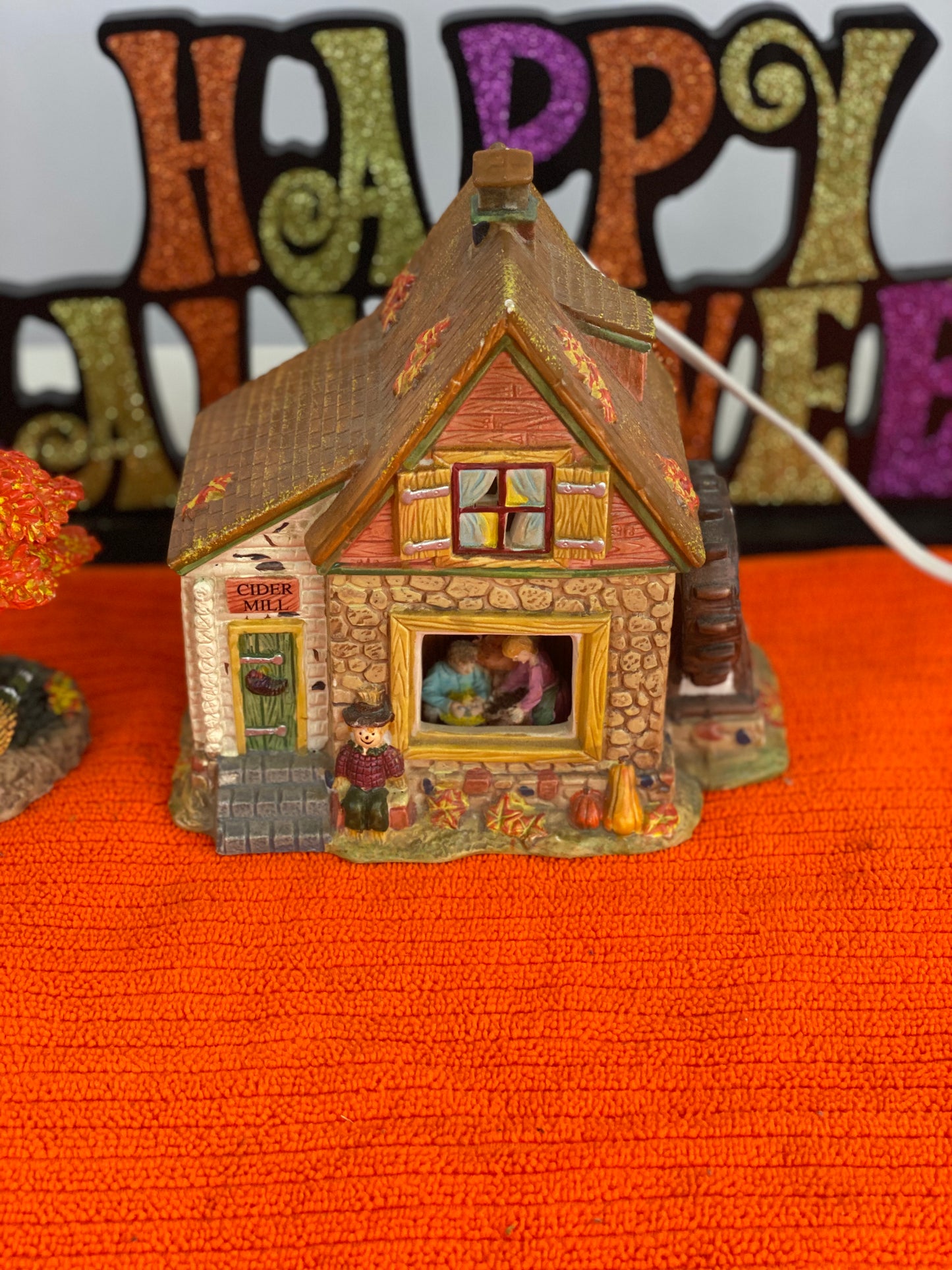 Ceramic  House/Cider Mill with Tree  House Approx.  6.5” H x 6” W  House is Electric/Illuminated with Autumn Decor  Tree is 6” H x 3.5 W with Autumn Decor