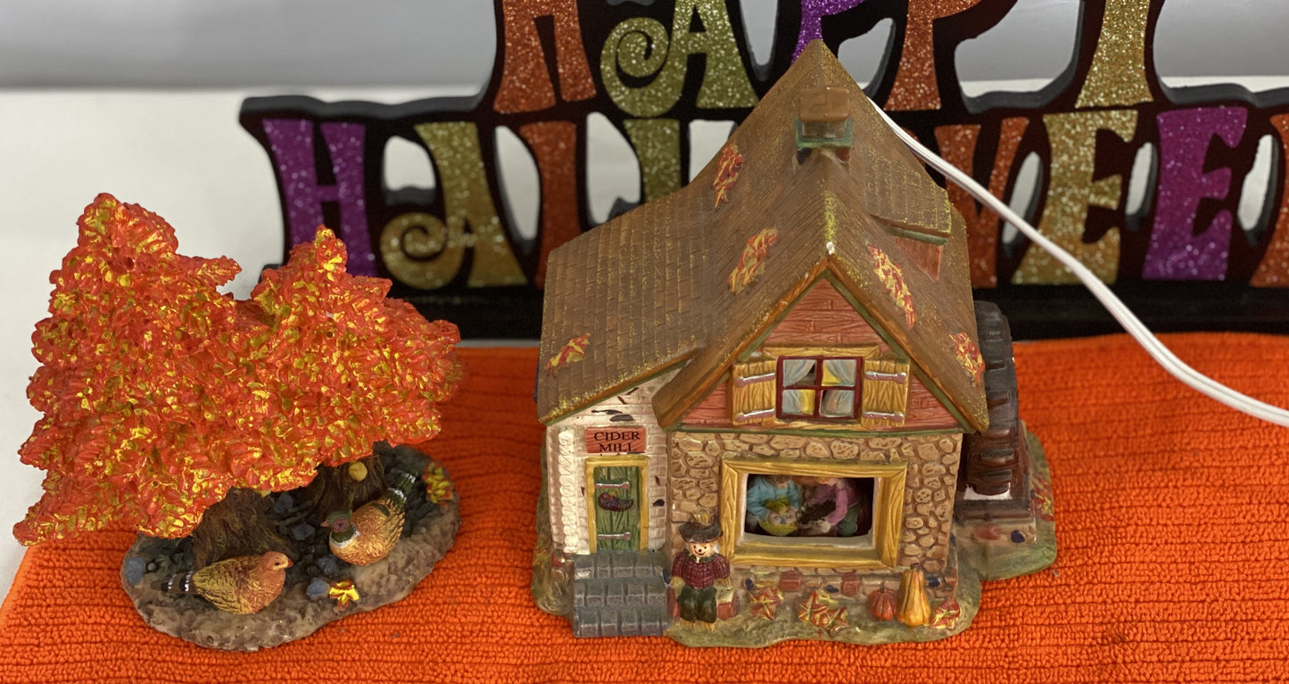 Ceramic  House/Cider Mill with Tree  House Approx.  6.5” H x 6” W  House is Electric/Illuminated with Autumn Decor  Tree is 6” H x 3.5 W with Autumn Decor