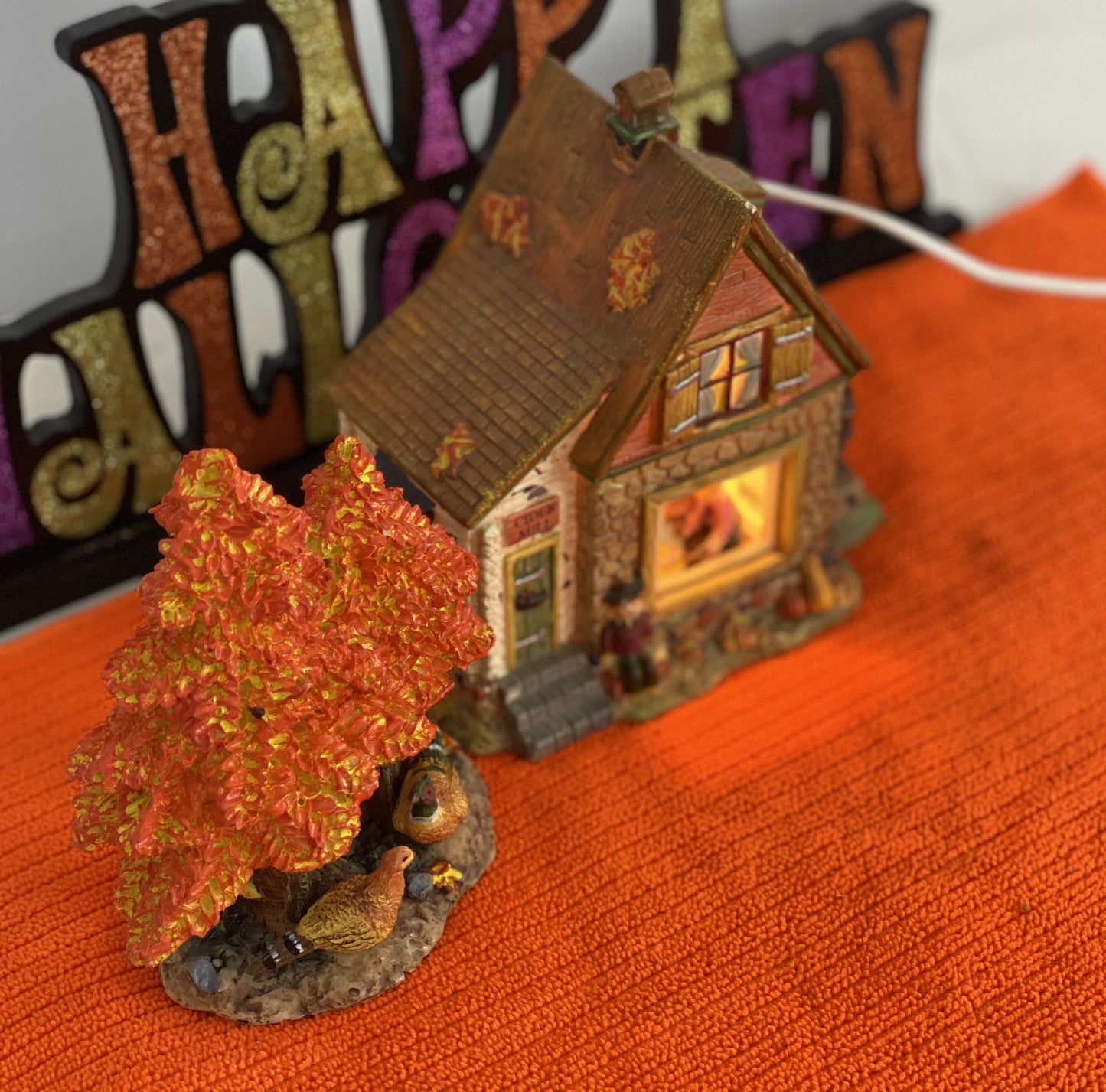 Ceramic  House/Cider Mill with Tree  House Approx.  6.5” H x 6” W  House is Electric/Illuminated with Autumn Decor  Tree is 6” H x 3.5 W with Autumn Decor