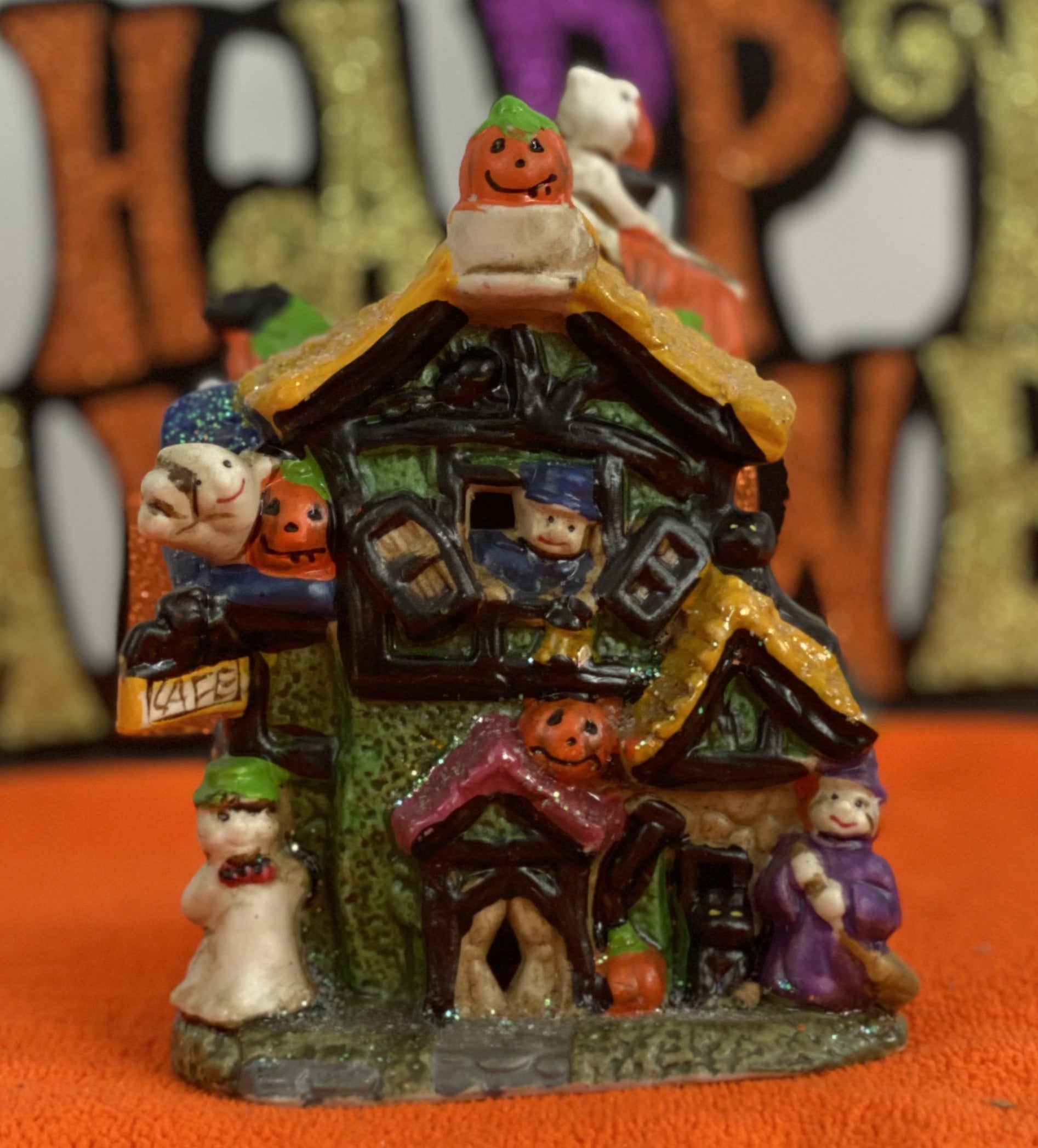 Set of Haunted Houses - Two (2)  Ceramic With Sparkly Finish  Many Decorations on Each House  Each House is Approx. 5”H x 4” W  Electric-Illumination