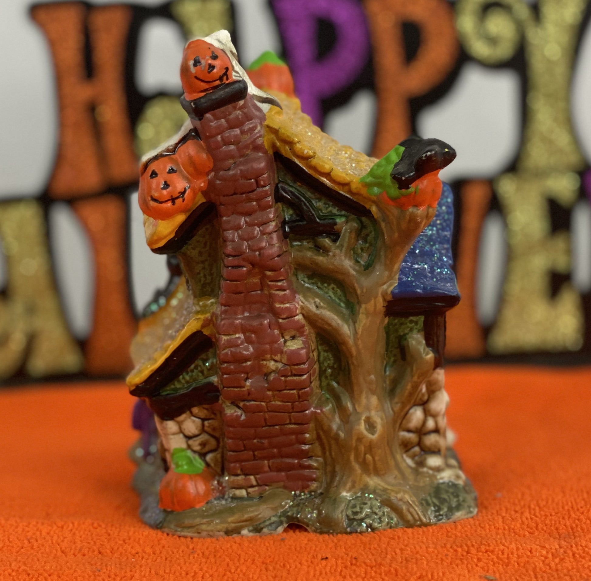 Set of Haunted Houses - Two (2)  Ceramic With Sparkly Finish  Many Decorations on Each House  Each House is Approx. 5”H x 4” W  Electric-Illumination