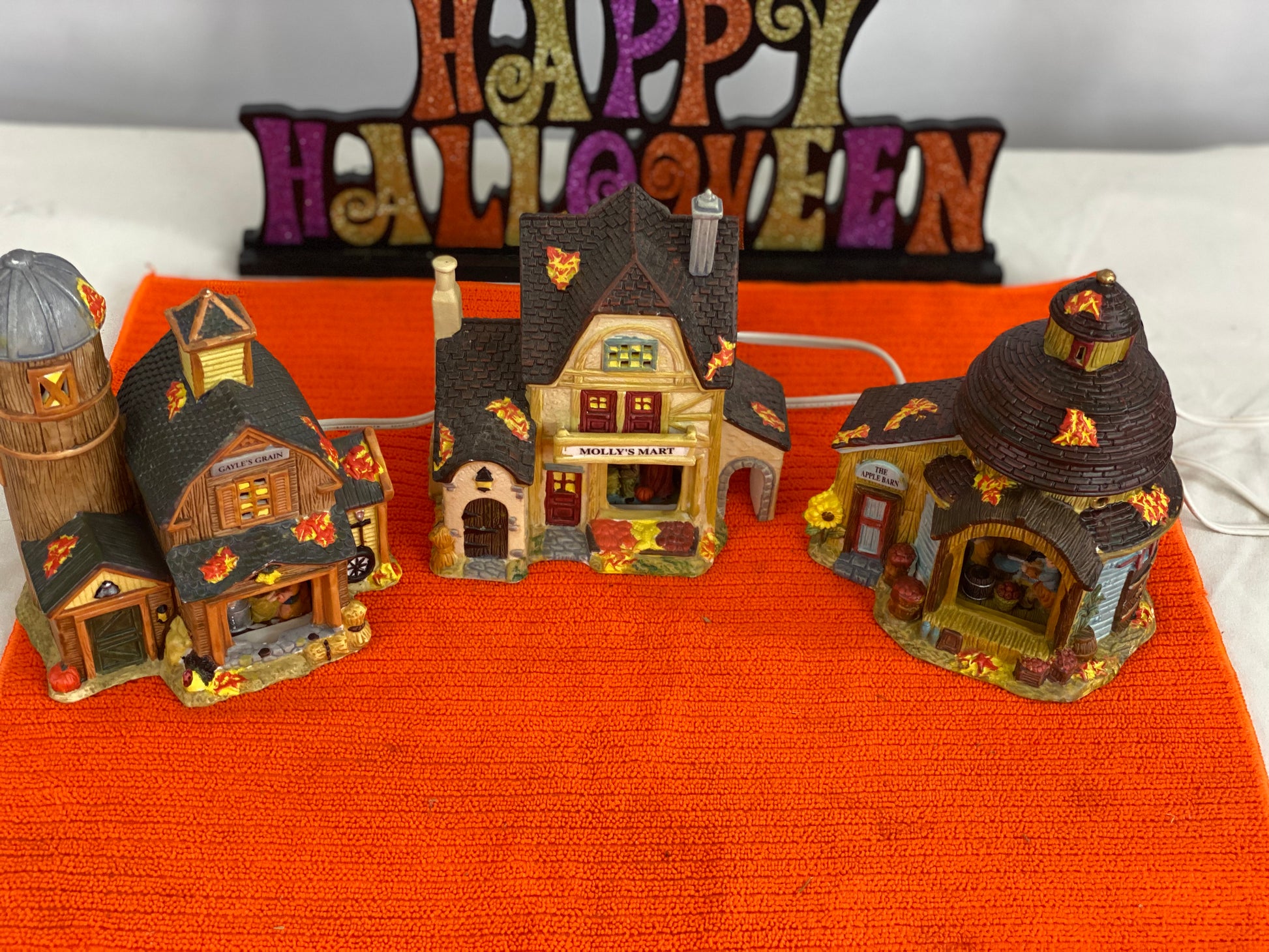 Gayle’s Grain Approx 6.5” H x 5” W x 3” D  Molly’s Mart  Approx  6.5” H x 5.75” W x 3.5” D  The Apple Barn Approx 6” H x 5” W x 4” D    Ceramic Pieces  Electric Lighting/Illumination  Great Detail of Autumn Decor