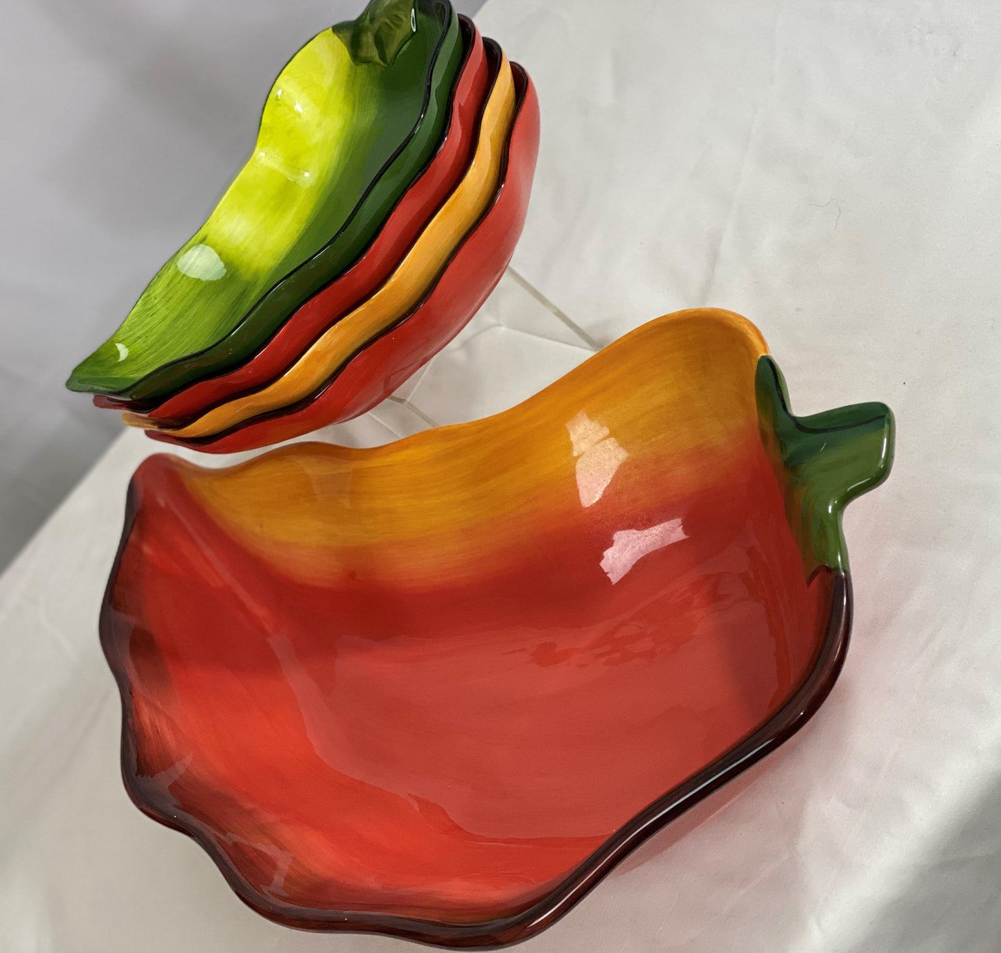 Chili Pepper Serving Set  Clay Art/Ceramic  One (1) Main Dish -- Red/Yellow  Approx 17” L x 8” W  Four Serving Dishes --  2 Red; 1 Yellow; 1 Green                                                                                                                                                                                                                                                                             Approx 9” L x 4 ½ ”W