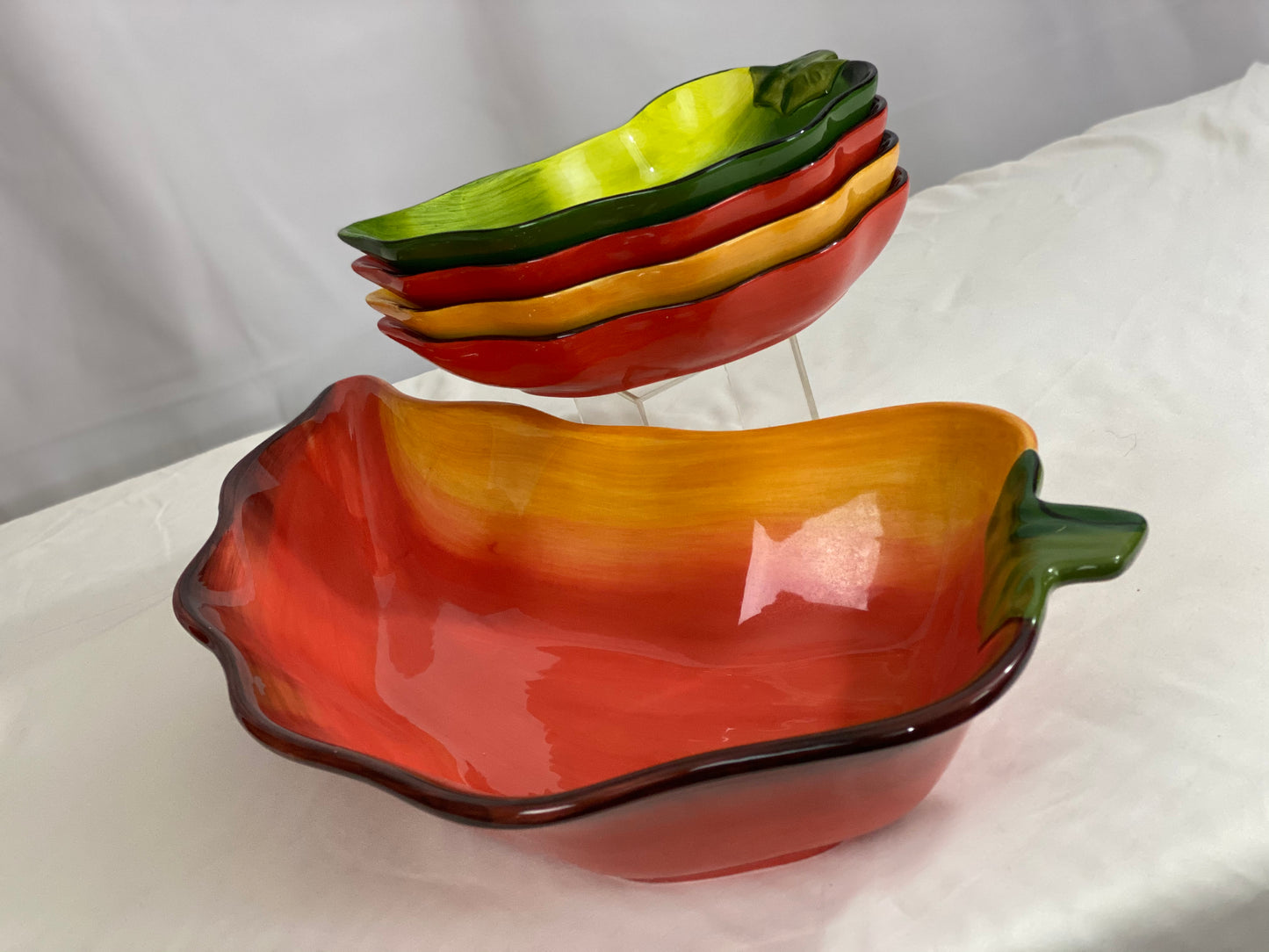 Chili Pepper Serving Set  Clay Art/Ceramic  One (1) Main Dish -- Red/Yellow  Approx 17” L x 8” W  Four Serving Dishes --  2 Red; 1 Yellow; 1 Green                                                                                                                                                                                                                                                                             Approx 9” L x 4 ½ ”W