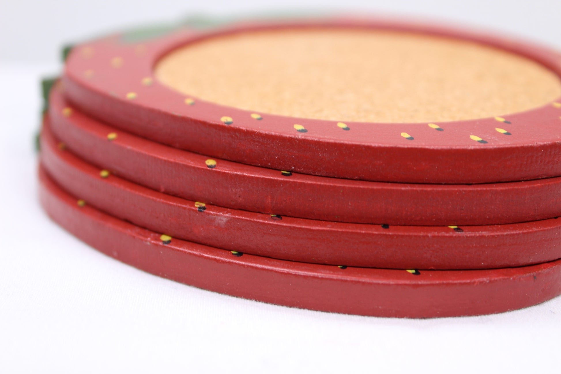 Set of four (4) Wooden Coasters 			Cork Inlay 			Strawberry Design 			Holder -  Wooden Shaped/Designed                Basket With Strawberries 	                                  Approx:    4.5”W x 5”H