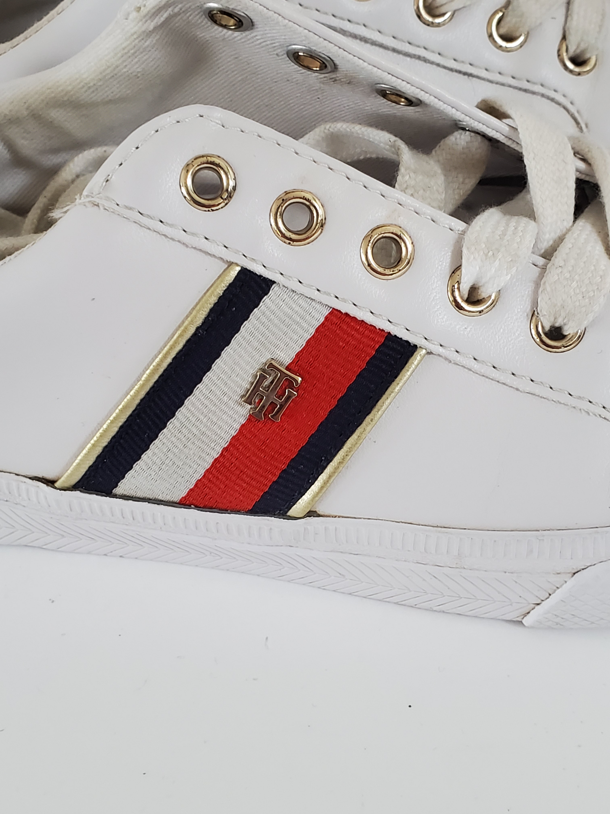 White with Red/White/Blue Stripe Accents  TH Initials on Side of Sneaker  Low Top - Lace up  Very Clean Pre-Owned Sneakers